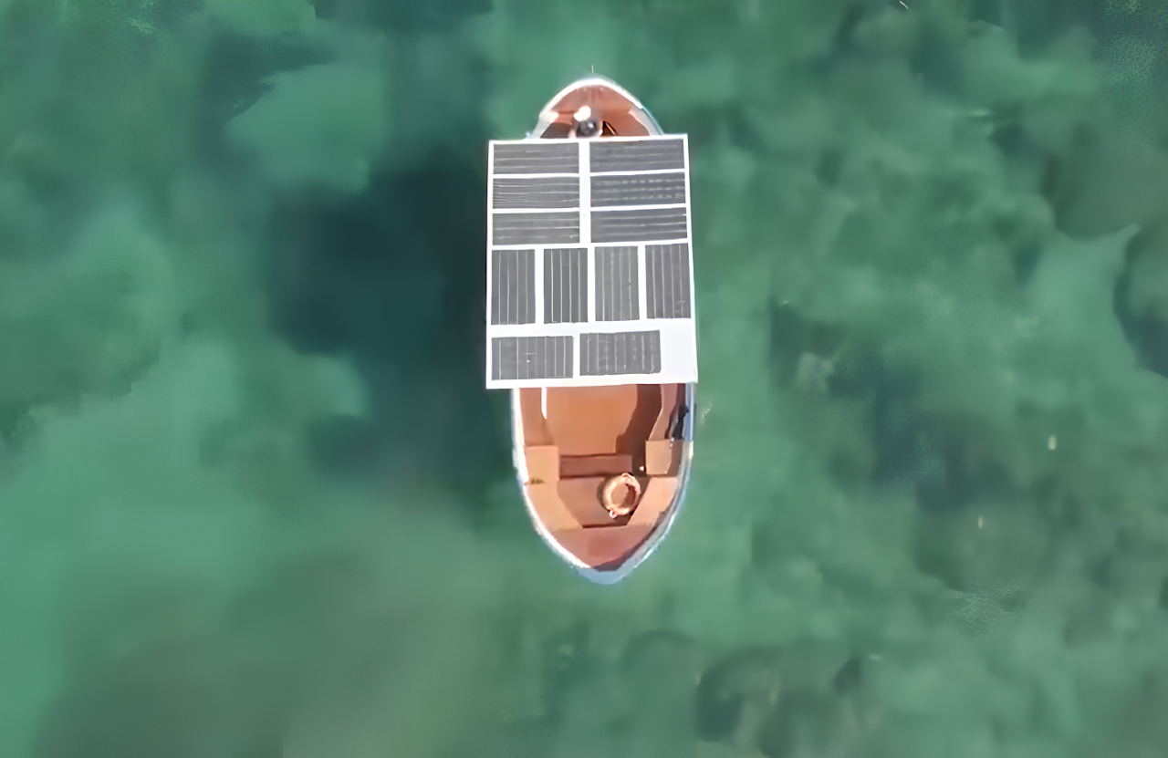 E-Vita electric boat in the sea, top down view